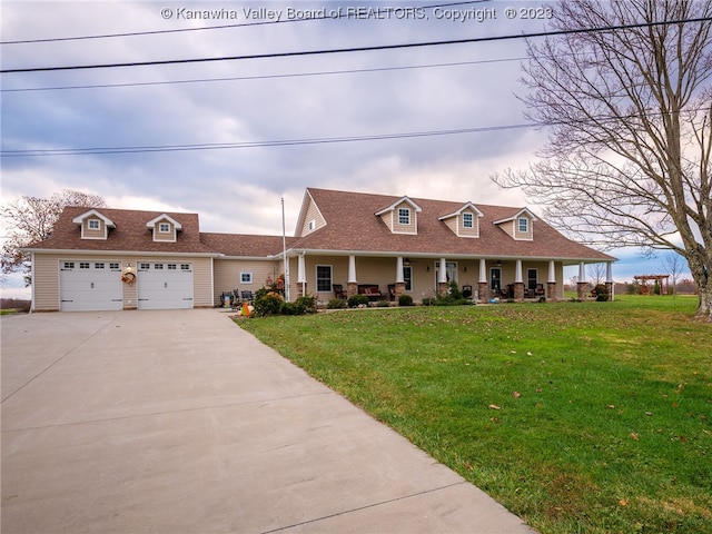 cape cod home with a front yard and a porch