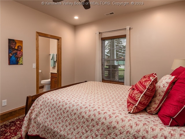 bedroom featuring ensuite bathroom, ceiling fan, and hardwood / wood-style floors