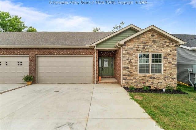 view of front of home with a garage, stone siding, driveway, and a shingled roof