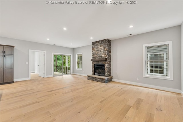 227 Woodland Dr, Milton, WV 25541 - unfurnished living room with light wood-style floors, baseboards, a fireplace, and recessed lighting