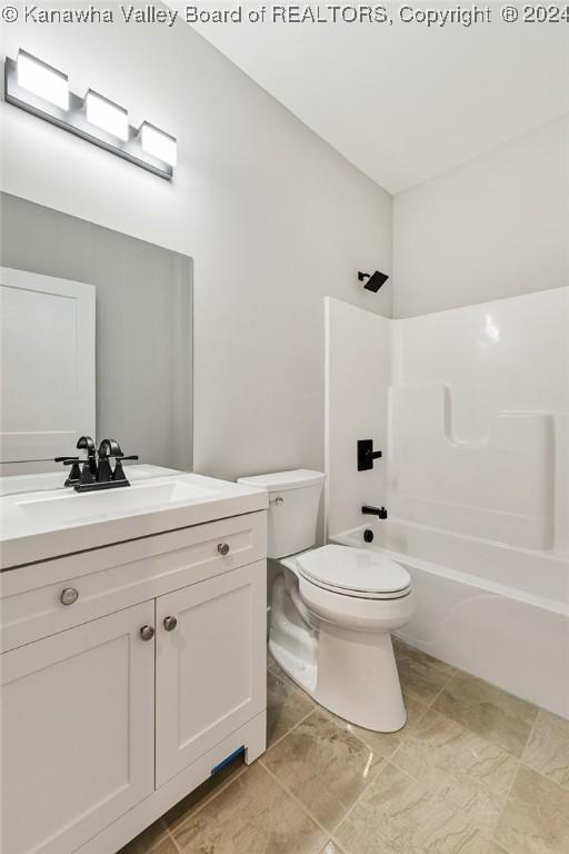 227 Woodland Dr, Milton, WV 25541 - bathroom featuring toilet, vanity, and bathing tub / shower combination