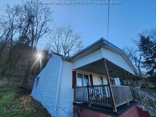 view of side of property featuring a porch