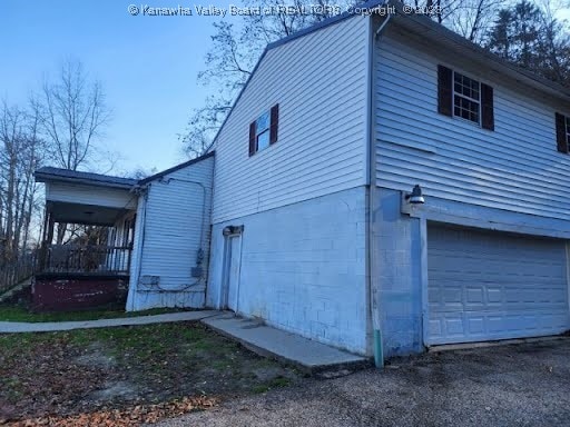 view of property exterior featuring a garage