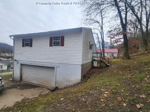 view of home's exterior with a garage