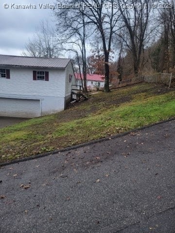 view of side of home featuring a garage