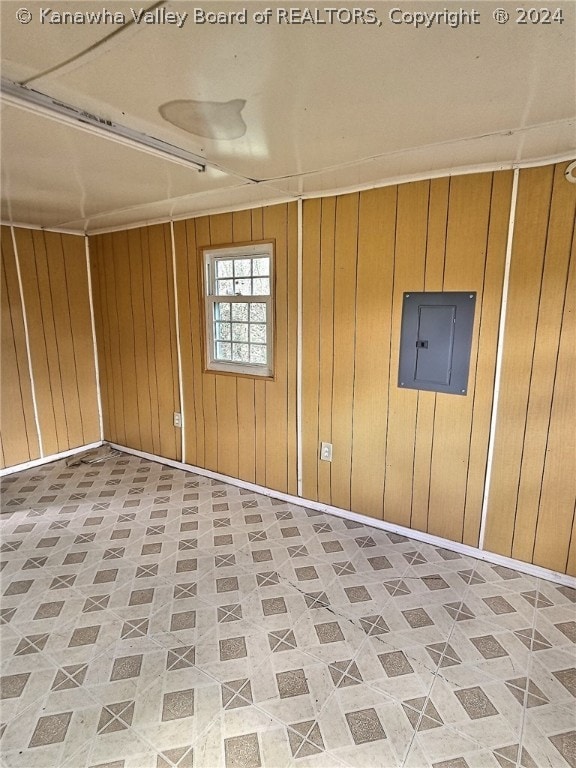 tiled spare room with wooden walls