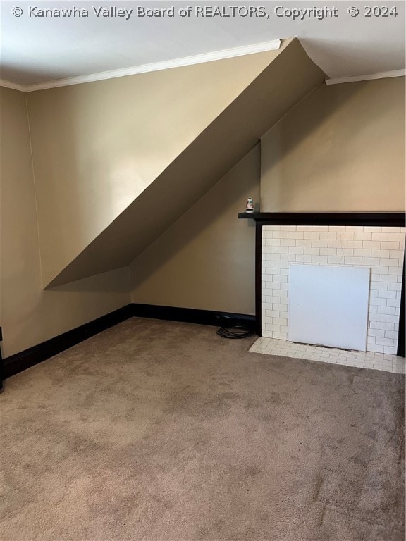 additional living space featuring light carpet and lofted ceiling