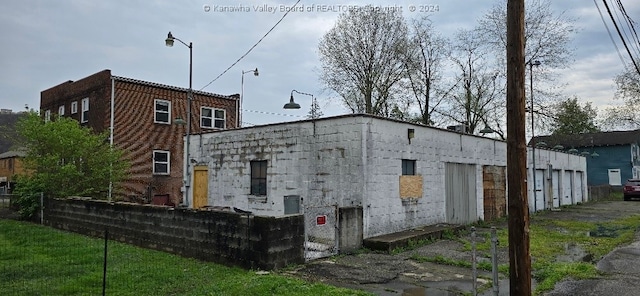 back of house featuring a garage