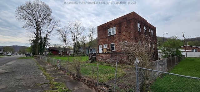 view of home's exterior featuring a yard