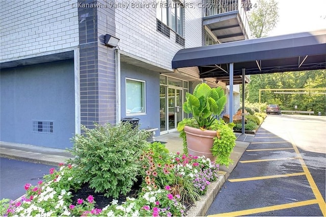 exterior space with a carport