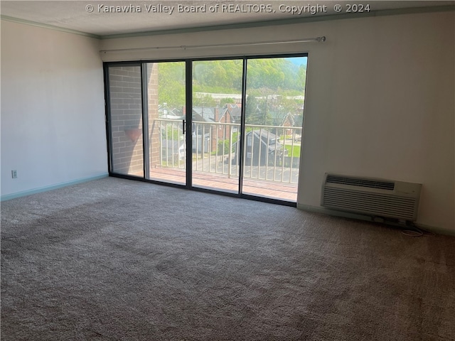 unfurnished room featuring a wealth of natural light, dark carpet, and ornamental molding