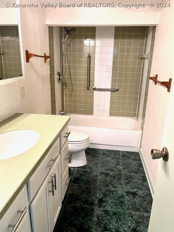 full bathroom with vanity, toilet, tiled shower / bath, and tile flooring