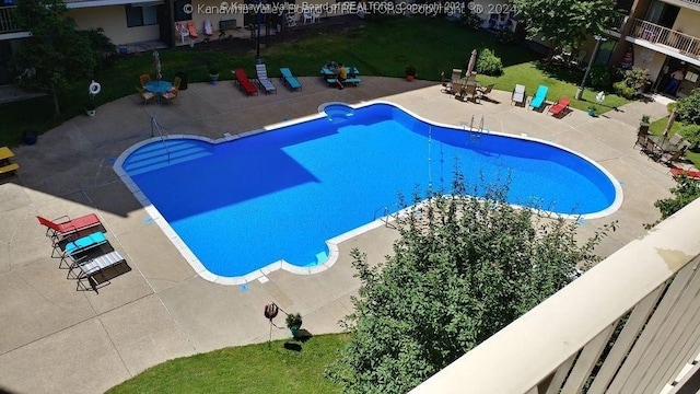 view of pool featuring a patio area