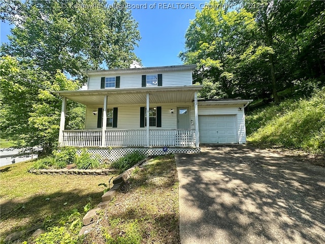 view of front of property with a garage and a porch