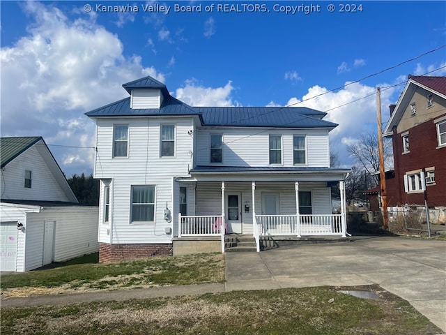 front of property with a garage and covered porch