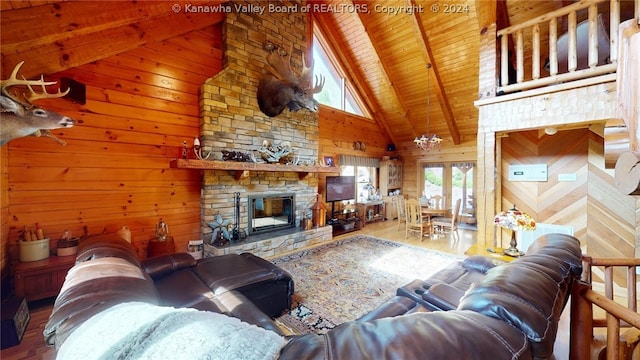 living room featuring beam ceiling, a fireplace, high vaulted ceiling, hardwood / wood-style flooring, and wooden ceiling