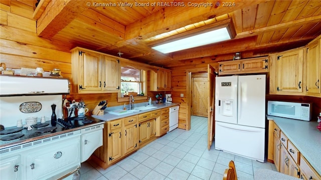 kitchen featuring beam ceiling, light tile flooring, white appliances, and wooden ceiling