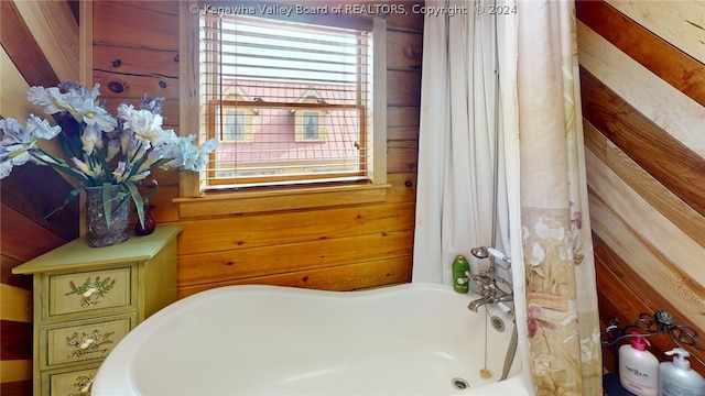 bedroom featuring wood walls