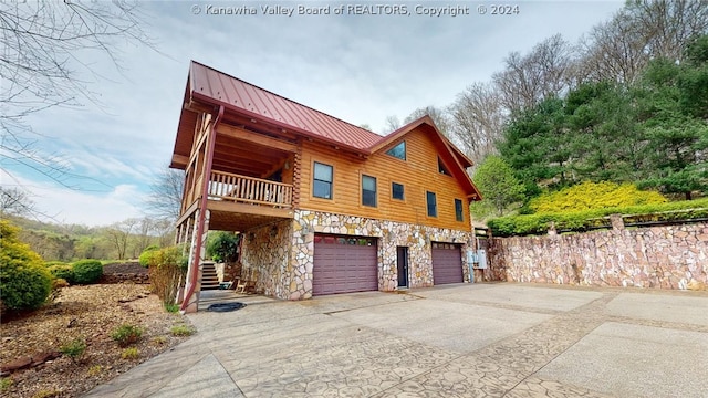 log home with a garage