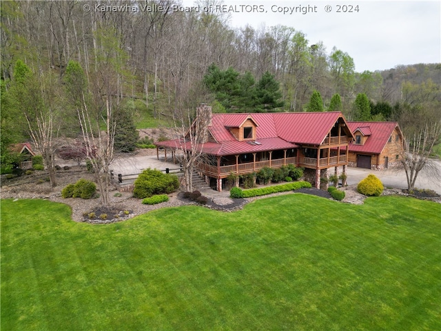 back of house with a lawn