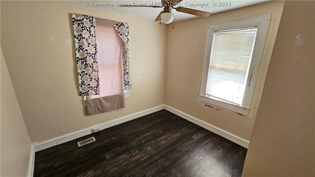 spare room with ceiling fan and hardwood / wood-style flooring