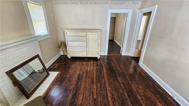 corridor with wood-type flooring