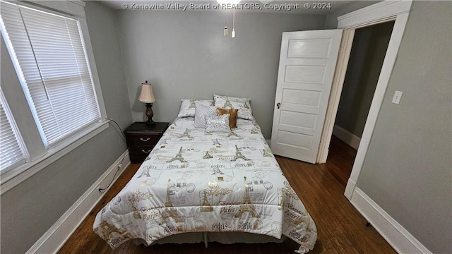 bedroom featuring dark hardwood / wood-style flooring