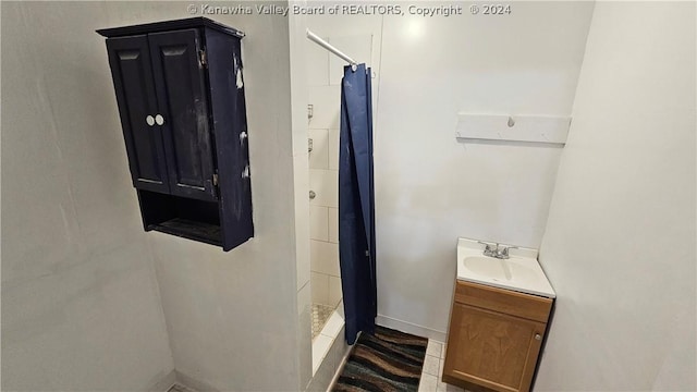 bathroom with vanity and a shower with shower curtain