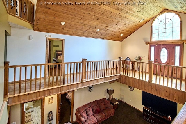 sitting room featuring wood ceiling and high vaulted ceiling