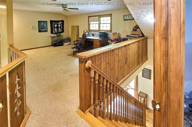 interior space with ceiling fan