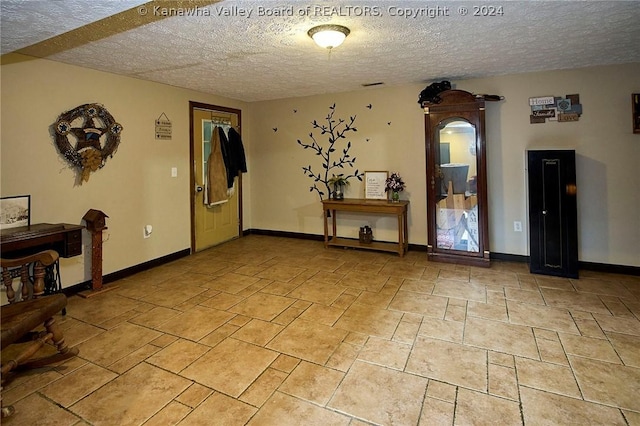 interior space featuring a textured ceiling