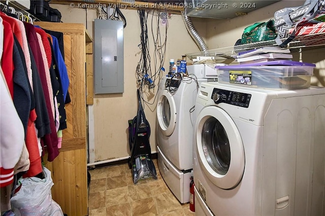 clothes washing area with independent washer and dryer and electric panel