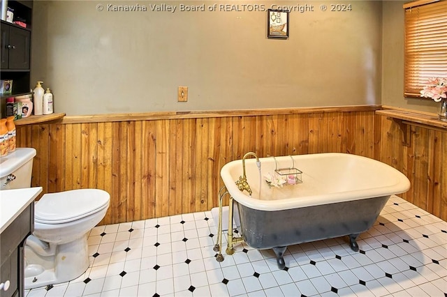 bathroom featuring wooden walls, toilet, and a tub