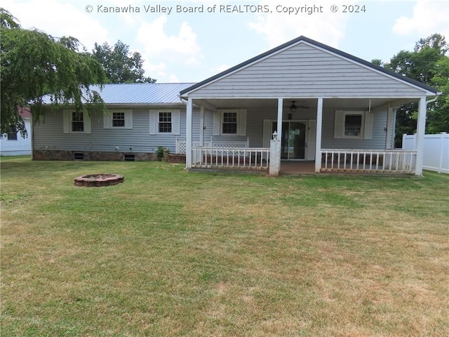 197 Oak Dr, Spencer, WV 25276 - exterior space with a front yard, a porch, and an outdoor fire pit