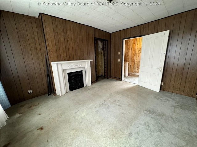 unfurnished living room featuring light carpet