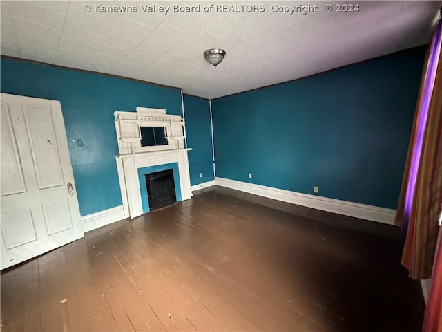 unfurnished living room with hardwood / wood-style flooring