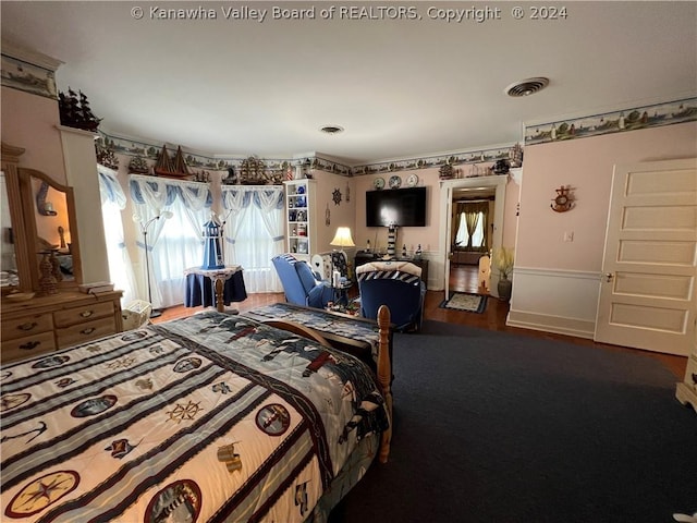 bedroom with wood-type flooring