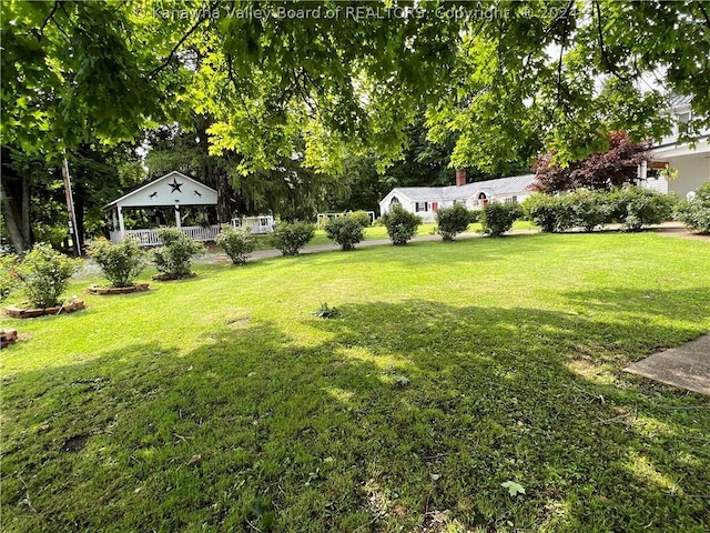 view of yard with covered porch