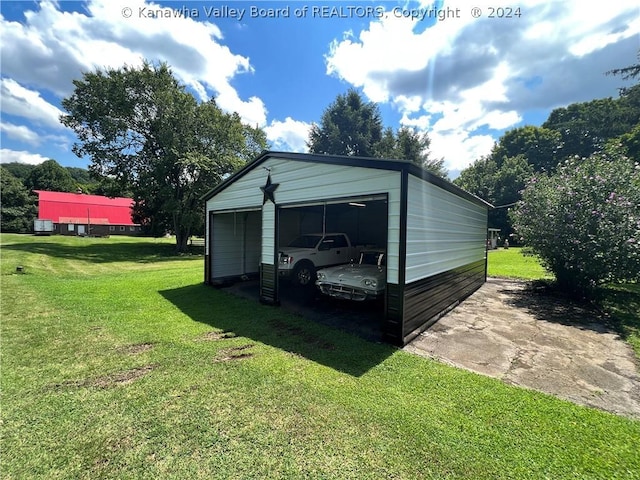 view of outbuilding featuring a garage and a lawn