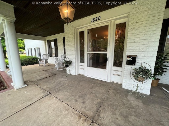 view of patio featuring a porch