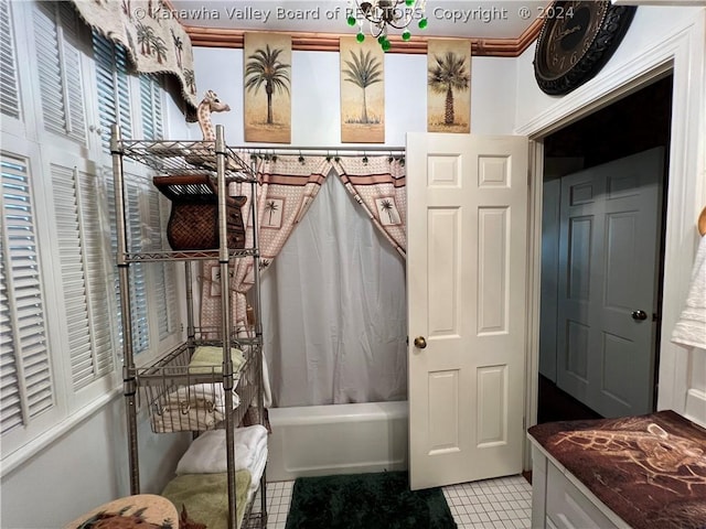 bathroom with tile patterned flooring and shower / bath combo with shower curtain