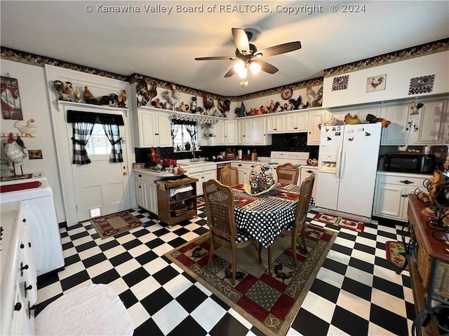 kitchen featuring white cabinetry, sink, and white appliances