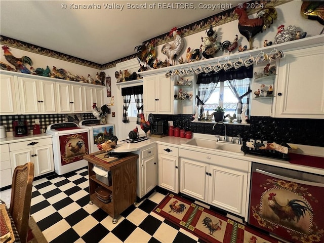 kitchen featuring white cabinetry, sink, washer and clothes dryer, and beverage cooler