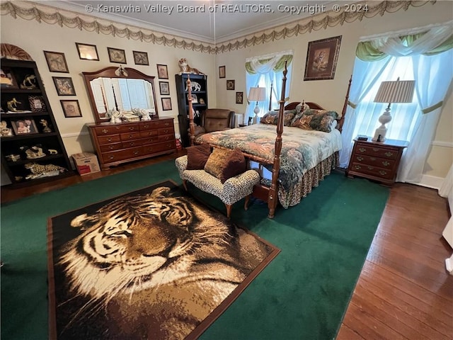 bedroom with multiple windows, crown molding, and dark hardwood / wood-style floors