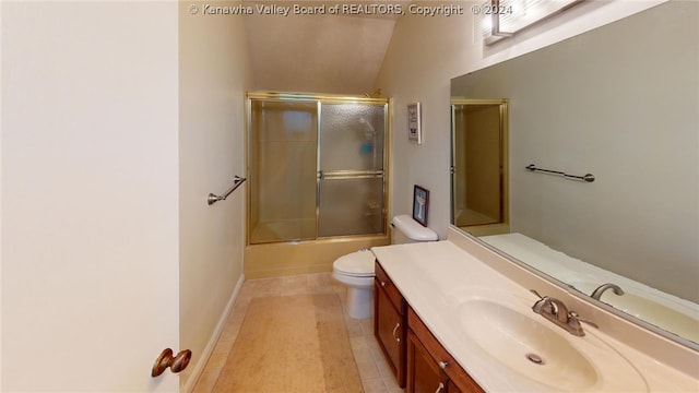 full bathroom featuring vanity, bath / shower combo with glass door, vaulted ceiling, tile patterned flooring, and toilet