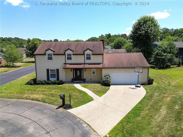 view of front of property featuring a front yard and a garage