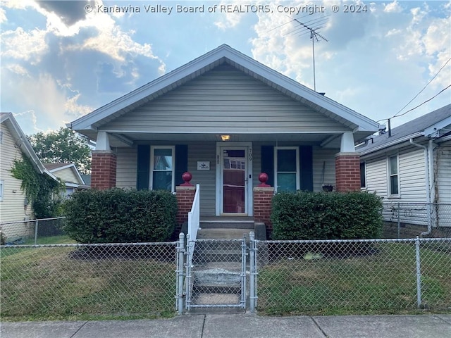 bungalow-style house featuring a front yard and a porch