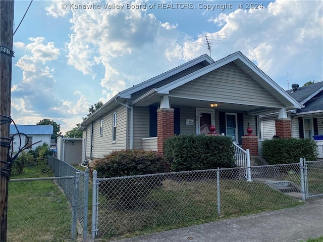 view of front of home with a front lawn and a porch