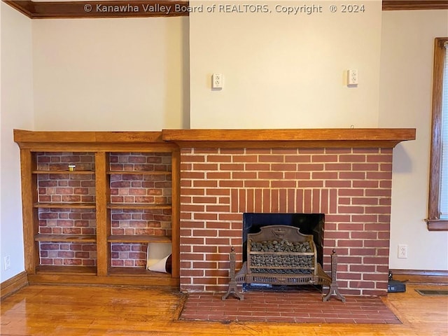 interior details with hardwood / wood-style flooring and a fireplace