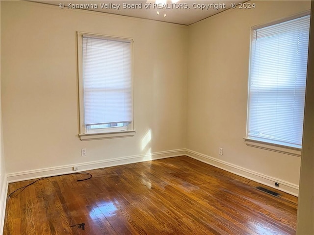 spare room featuring hardwood / wood-style floors